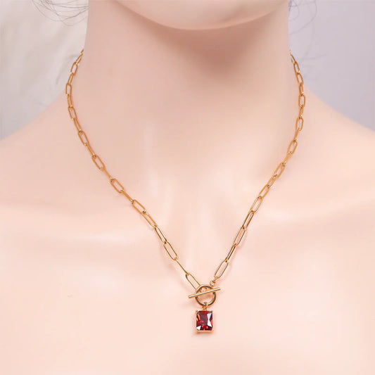 Front view of a model wearing the MEHRZEB luxury toggle clasp ruby red necklace.