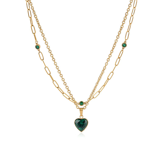 MEHRZEB 18k gold plated double layered necklace with emerald green heart pendant on white background.