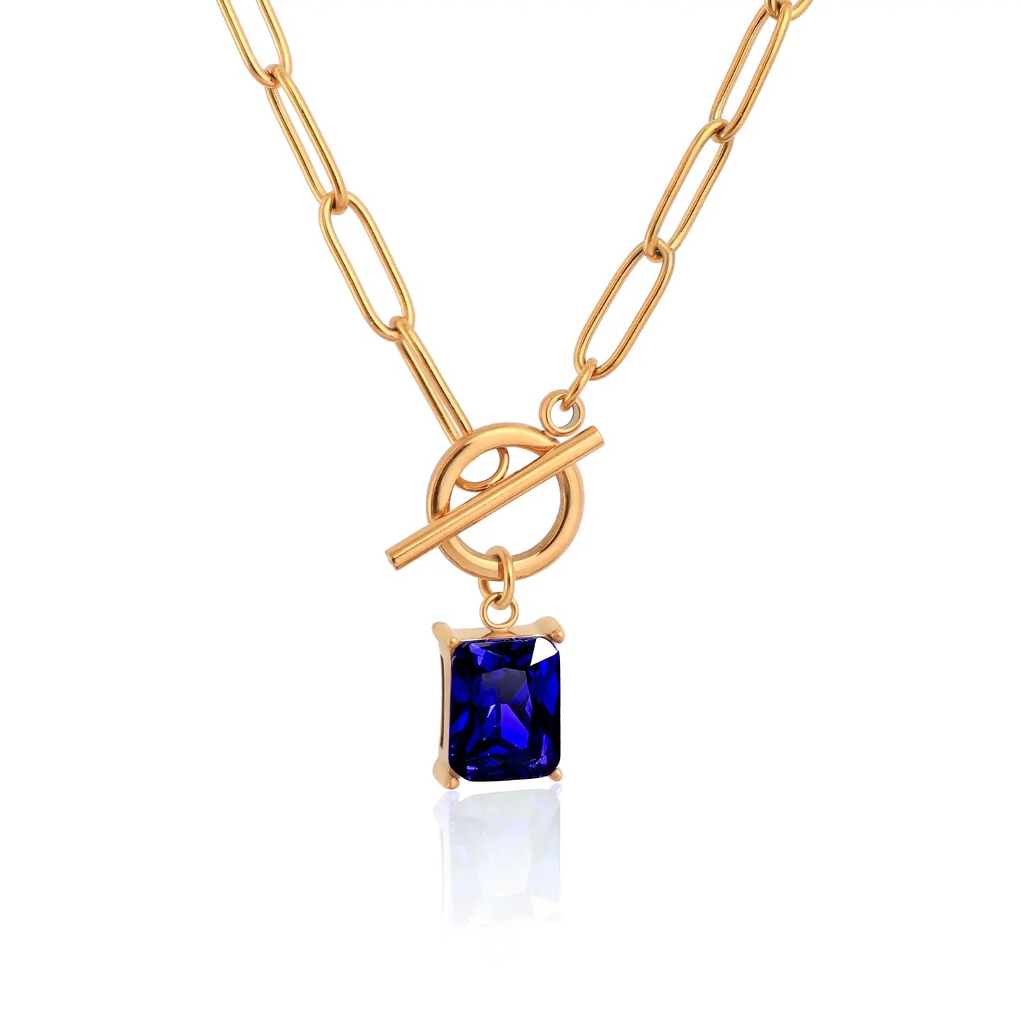 MEHRZEB 18k gold plated paperclip chain necklace with rectangular sapphire blue zircon on white background.