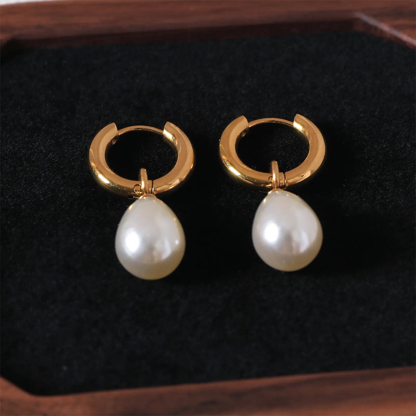 MEHRZEB premium faux pearl earrings elegantly styled on a dark high-contrast jewelry tray.