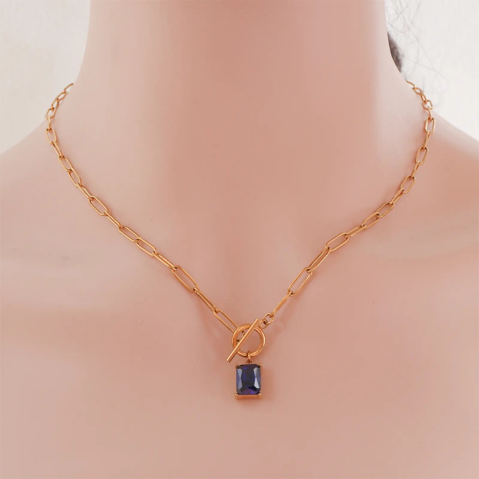 Front view of model wearing the MEHRZEB luxury toggle clasp sapphire necklace.
